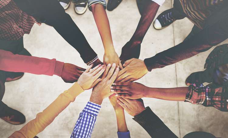 team-hands-AdobeStock_93583895.jpeg